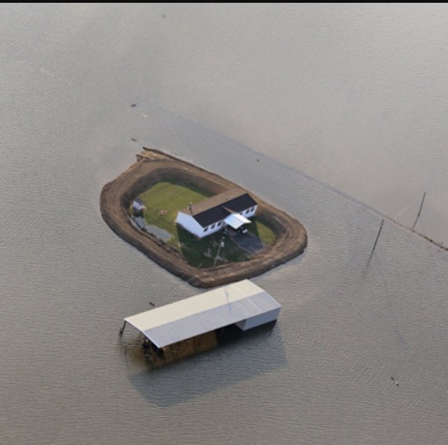 levee fully surrounded home